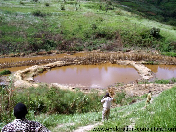 An accomplished dam ready for dewatering and mining.