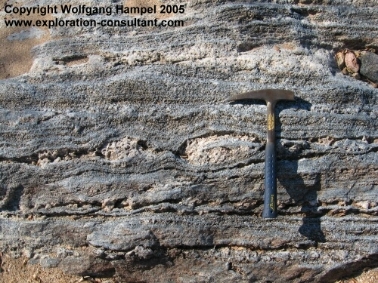 Scapolitite-boudins in a pyroxene rich layer in marble; from an outcrop near Besa-Esiva.