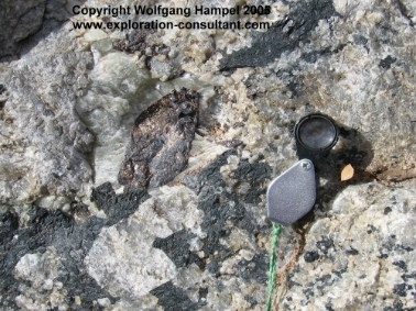 Scapolite and titanite crystals in a pyroxene and wollastonite rich zone in marble; near Ambatotsivala